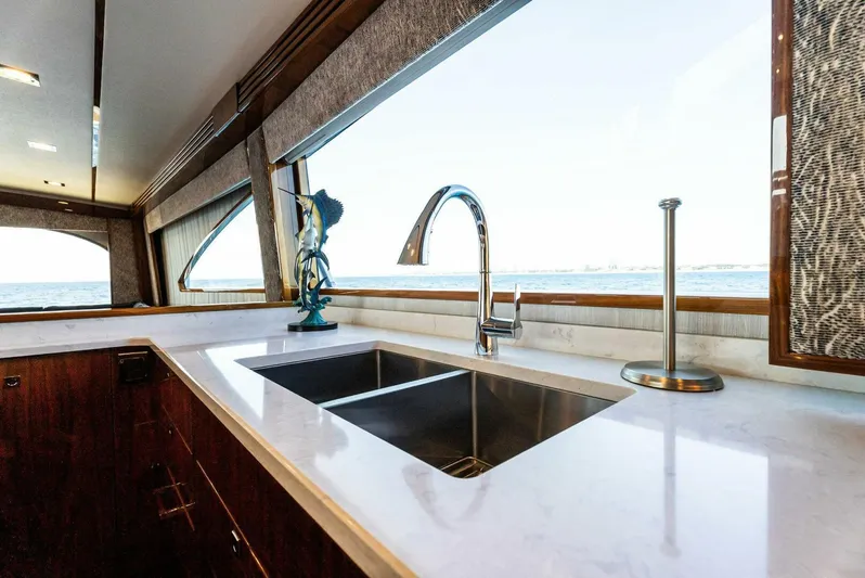 Rachel Anne Yacht Photos Pics Luxurious kitchen interior on 2022 Viking 80 yacht with ocean view.