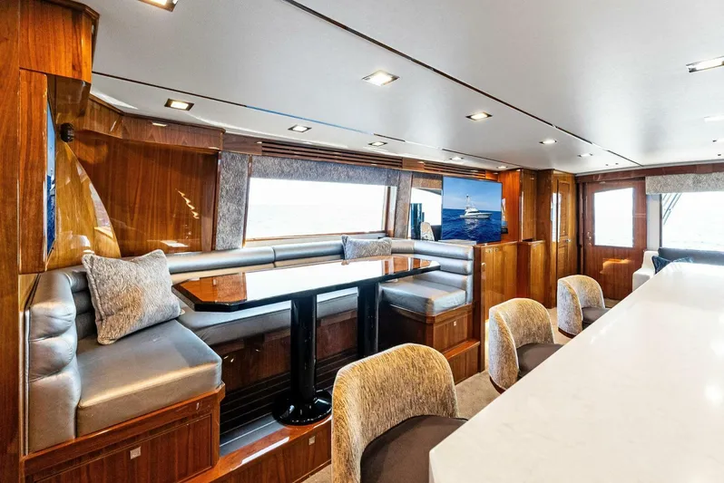 Rachel Anne Yacht Photos Pics Luxurious interior of 2022 Viking 80 yacht with elegant seating and modern design.