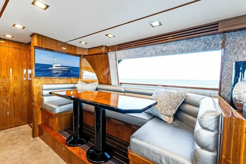 Rachel Anne Yacht Photos Pics Luxurious interior of 2022 Viking 80 yacht with elegant seating and ocean view.