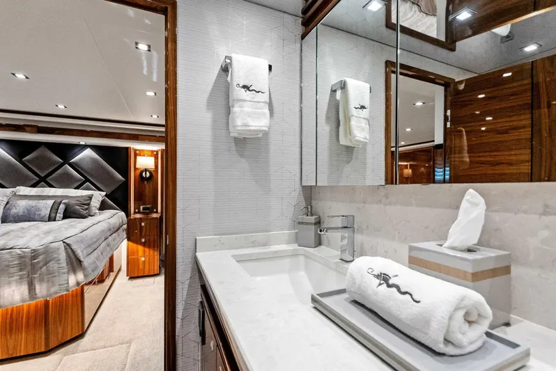Rachel Anne Yacht Photos Pics Luxurious bathroom in 2022 Viking 80 yacht with elegant design and plush amenities.