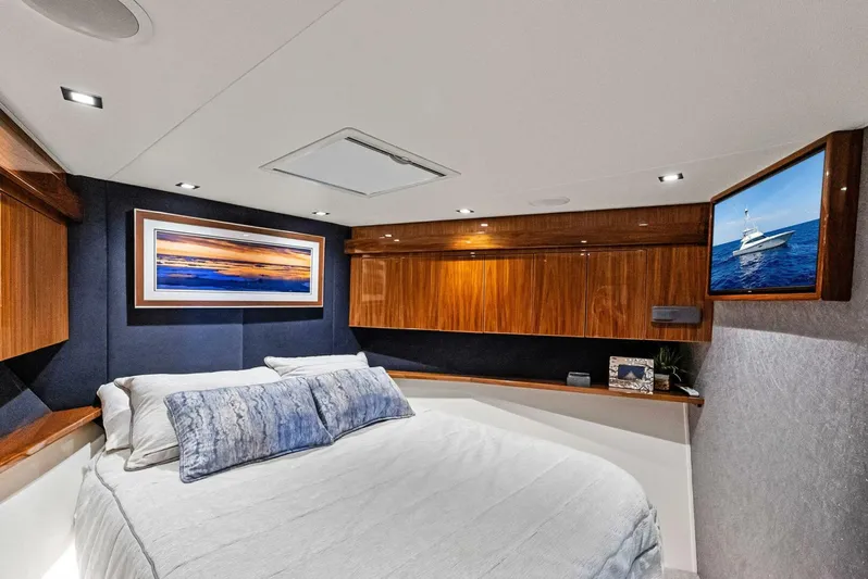 Rachel Anne Yacht Photos Pics Luxurious cabin interior of 2022 Viking 80 yacht with elegant wood finishes and modern decor.