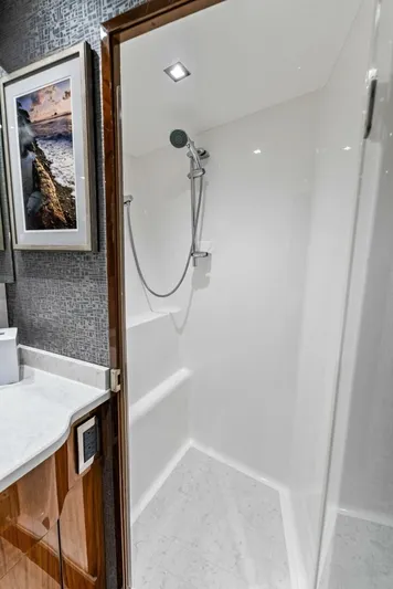 Rachel Anne Yacht Photos Pics Modern shower in 2022 Viking 80 yacht with sleek design and elegant fixtures.
