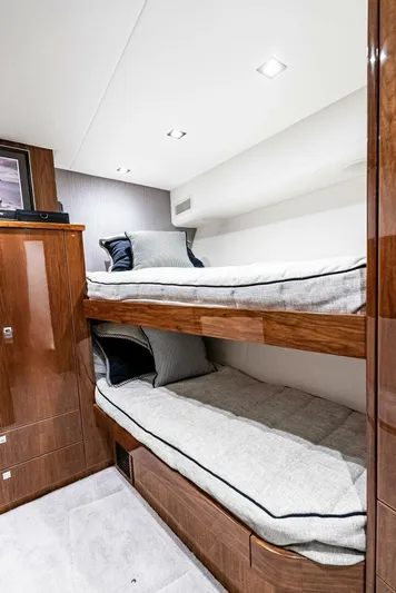 Rachel Anne Yacht Photos Pics Luxury bunk beds in 2022 Viking 80 yacht cabin with modern wood finish.