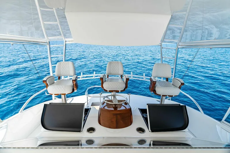 Rachel Anne Yacht Photos Pics Luxury Viking 80 yacht helm with three chairs, overlooking the ocean, 2022 model.
