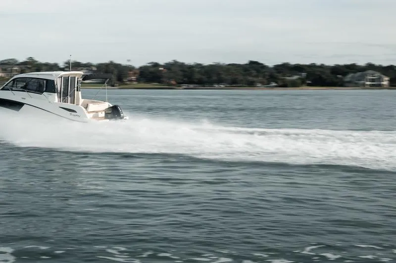  Yacht Photos Pics 2026 Trophy T25EX EXPLORER OB boat cruising on a serene lake.