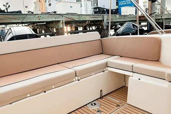  Yacht Photos Pics 2026 Trophy T25EX EXPLORER OB boat with beige seating and wooden deck.