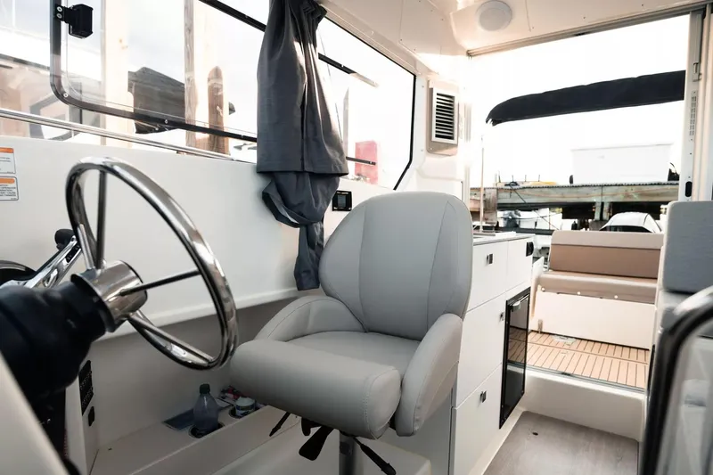  Yacht Photos Pics Interior of 2026 Trophy T25EX EXPLORER OB boat with steering wheel and seating.