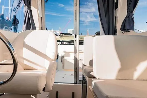  Yacht Photos Pics Interior view of 2026 Trophy T25EX EXPLORER OB boat with plush seating and modern design.