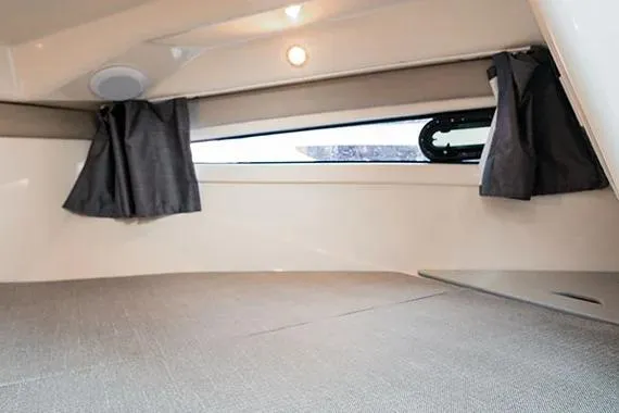  Yacht Photos Pics 2026 Trophy T25EX EXPLORER OB cabin interior with window and curtains.