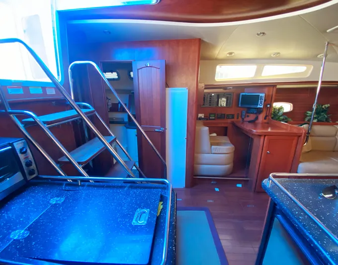 Pending Yacht Photos Pics Interior of 2012 Hunter 50 Aft Cockpit yacht with modern amenities and wooden finishes.