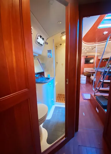 Pending Yacht Photos Pics Interior of 2012 Hunter 50 Aft Cockpit yacht, featuring bathroom and living area.