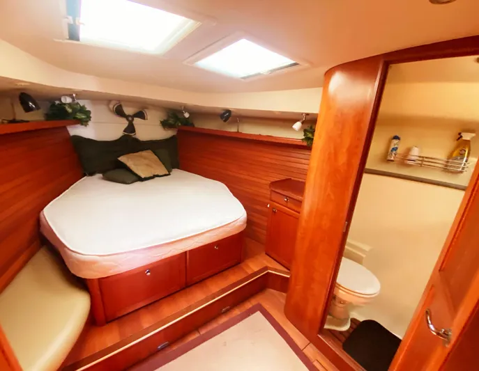 Pending Yacht Photos Pics Luxurious 2012 Hunter 50 Aft Cockpit yacht interior with cozy bedroom and bathroom.