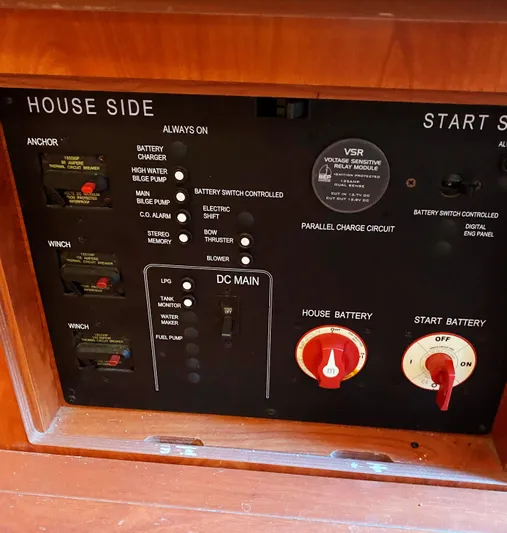 Pending Yacht Photos Pics Control panel of a 2012 Hunter 50 Aft Cockpit yacht, featuring battery and switch controls.