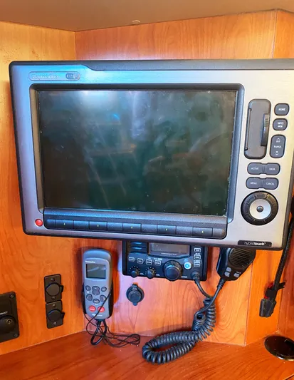 Pending Yacht Photos Pics Control panel of 2012 Hunter 50 Aft Cockpit with navigation and communication devices.