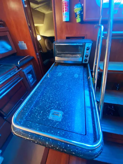 Pending Yacht Photos Pics Hunter 50 Aft Cockpit 2012 yacht interior with kitchenette and stairs.