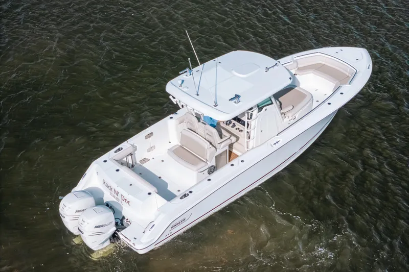  Yacht Photos Pics 2019 Boston Whaler 330 Outrage boat on water, aerial view.
