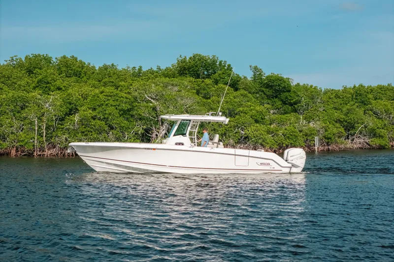  Yacht Photos Pics 2019 Boston Whaler 330 Outrage on calm water near mangroves.
