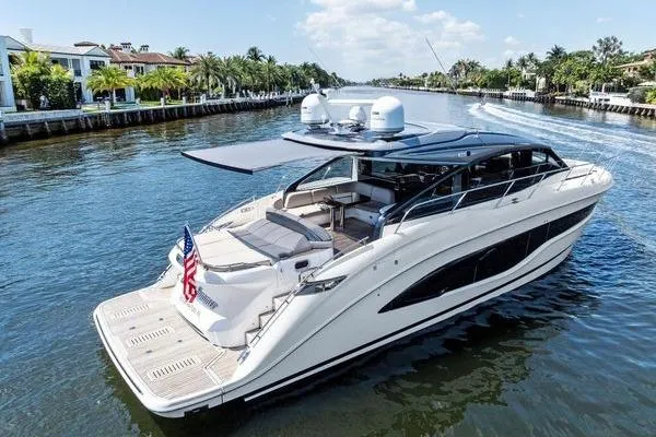 Endless Summer Yacht Photos Pics Luxurious 2020 Princess V55 yacht cruising on a scenic waterway.