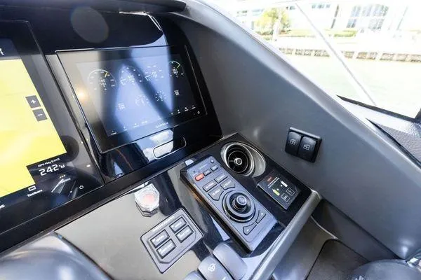 Endless Summer Yacht Photos Pics Control panel of 2020 Princess V55 yacht with modern navigation displays and controls.