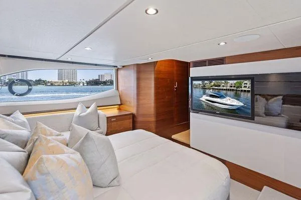 Endless Summer Yacht Photos Pics Luxurious interior of 2020 Princess V55 yacht with modern decor and waterfront view.