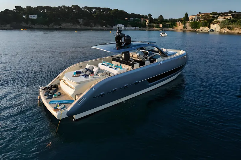  Yacht Photos Pics 2023 Invictus TT460 yacht on serene water, showcasing luxury design and modern features.