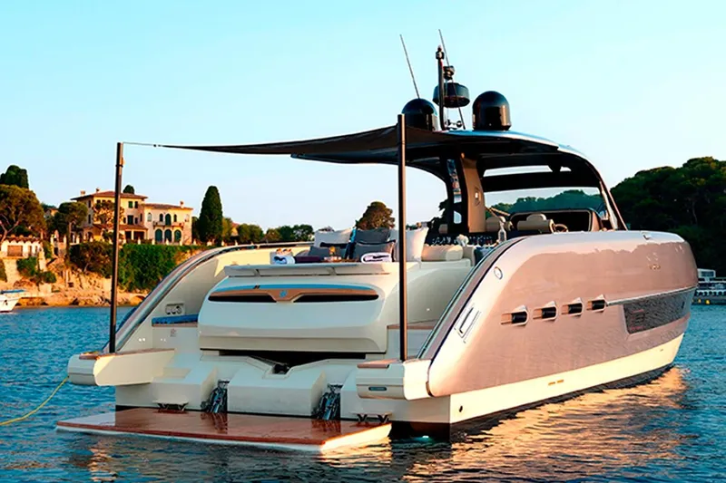  Yacht Photos Pics 2023 Invictus TT460 yacht on serene water, luxury design, coastal backdrop.