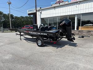 2025 Tracker Pro Team 175 Crappie Edition boat on trailer outside dealership.
