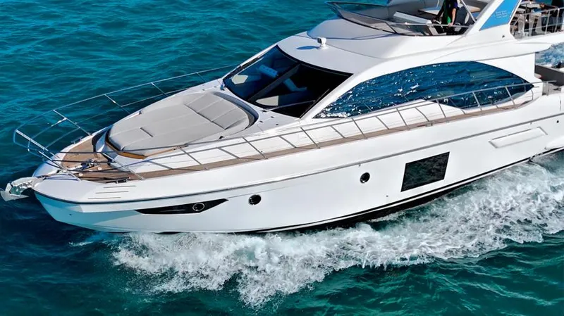 Resilience Yacht Photos Pics Luxury Azimut 55 yacht cruising on clear blue water, 2021 model.