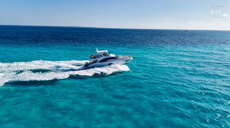 Resilience Yacht Photos Pics 2021 Azimut 55 yacht cruising on clear blue ocean waters.