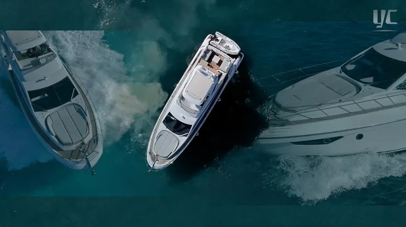 Resilience Yacht Photos Pics Aerial view of 2021 Azimut 55 yacht cruising in clear blue waters.
