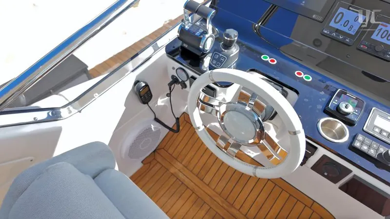 Resilience Yacht Photos Pics Cockpit of 2021 Azimut 55 yacht with modern controls and wooden flooring.