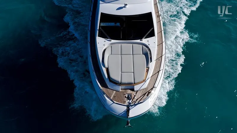 Resilience Yacht Photos Pics Aerial view of 2021 Azimut 55 yacht cruising on turquoise water.