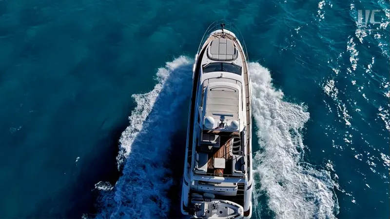 Resilience Yacht Photos Pics Aerial view of 2021 Azimut 55 yacht cruising on clear blue water.