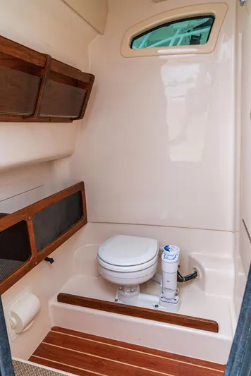 41698-i - Ingman Stock Boat Yacht Photos Pics 2025 Grady-White 281 Coastal Explorer boat bathroom with toilet and storage.