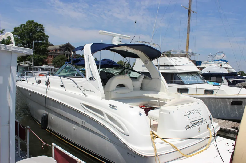  Yacht Photos Pics 2003 Sea Ray 380 Sundancer docked at marina, featuring sleek design and spacious deck.
