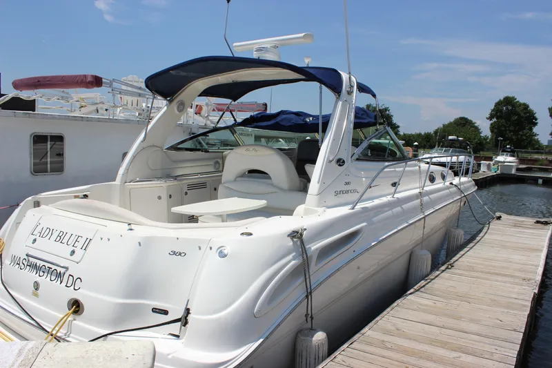  Yacht Photos Pics 2003 Sea Ray 380 Sundancer docked, featuring sleek design and spacious deck.