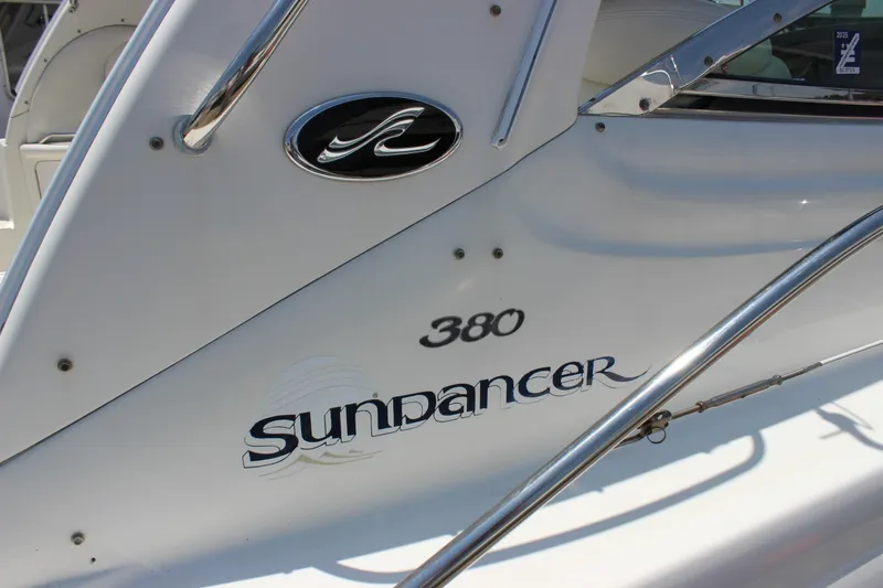  Yacht Photos Pics 2003 Sea Ray 380 Sundancer boat side view with logo and chrome railing.