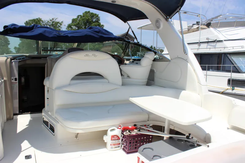  Yacht Photos Pics 2003 Sea Ray 380 Sundancer yacht interior with white seating and table.