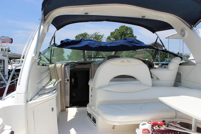  Yacht Photos Pics 2003 Sea Ray 380 Sundancer yacht interior with white seating and blue canopy.