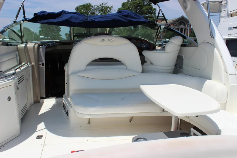 Yacht Photos Pics 2003 Sea Ray 380 Sundancer yacht interior with white seating and table.