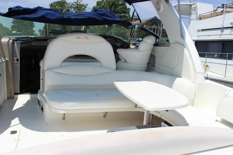  Yacht Photos Pics 2003 Sea Ray 380 Sundancer yacht interior with white seating and table.
