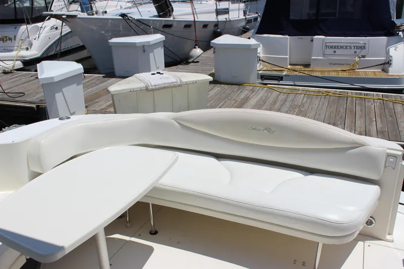 Yacht Photos Pics 2003 Sea Ray 380 Sundancer yacht with white seating and table at dock.