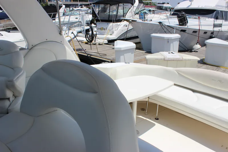  Yacht Photos Pics 2003 Sea Ray 380 Sundancer yacht interior with white seating at marina.