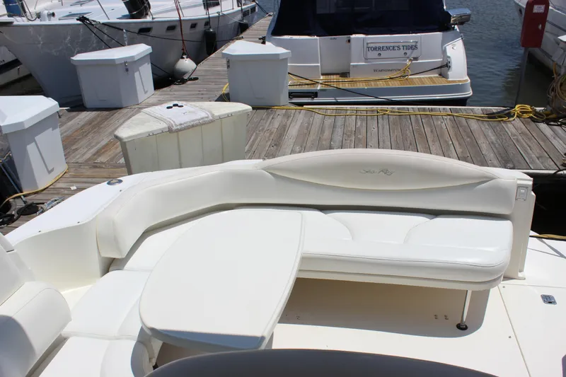  Yacht Photos Pics 2003 Sea Ray 380 Sundancer boat with white seating at a marina dock.
