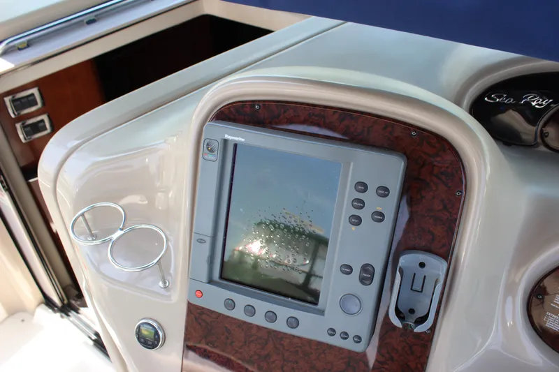  Yacht Photos Pics Control panel of 2003 Sea Ray 380 Sundancer with navigation display and cup holders.