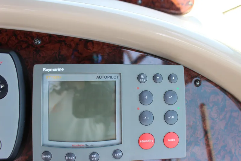  Yacht Photos Pics Raymarine autopilot control panel on 2003 Sea Ray 380 Sundancer boat dashboard.
