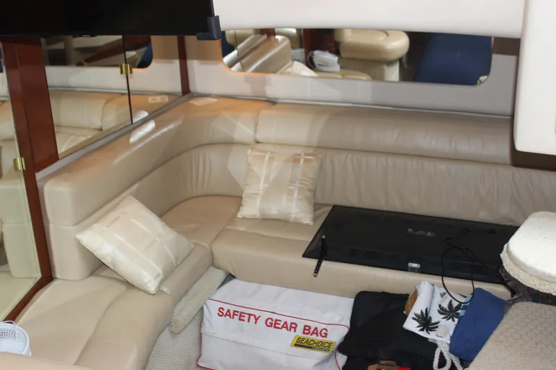  Yacht Photos Pics Interior of 2003 Sea Ray 380 Sundancer with beige seating and safety gear bag.