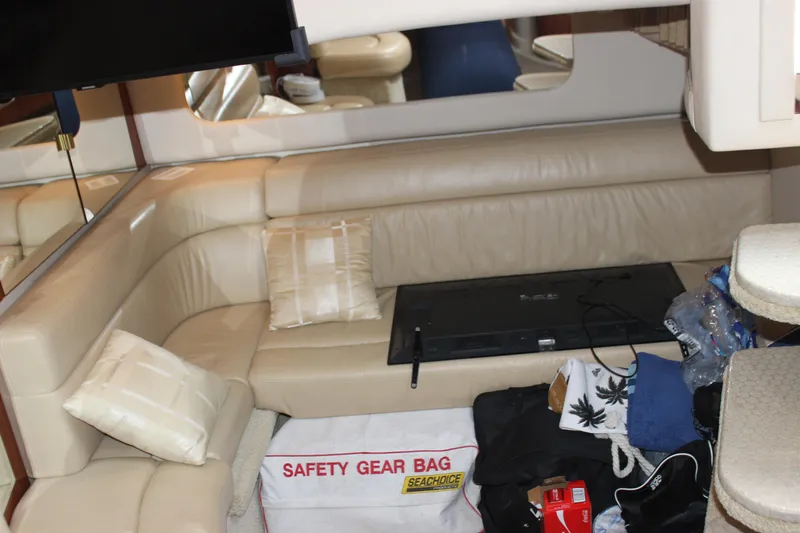  Yacht Photos Pics Interior of 2003 Sea Ray 380 Sundancer with beige seating and safety gear bag.