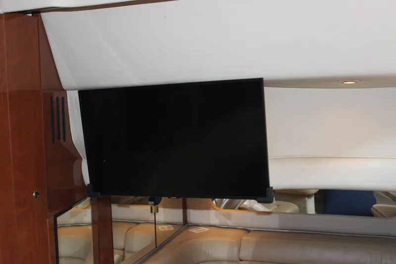  Yacht Photos Pics Interior of 2003 Sea Ray 380 Sundancer with mounted flat-screen TV.