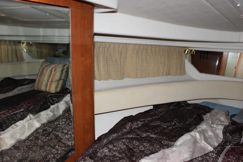  Yacht Photos Pics Interior cabin of 2003 Sea Ray 380 Sundancer with bed and mirror.